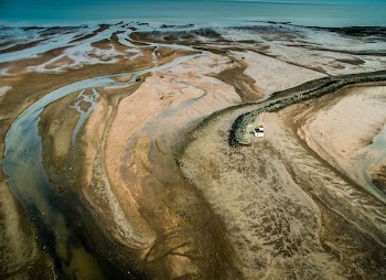 top view photography of house near body of water