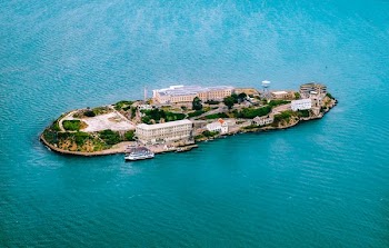 top view photography of island surrounded by body of water