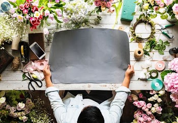 top view photography of person holding black pad