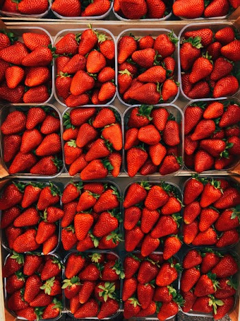 Top View Photography of Strawberries on Containers