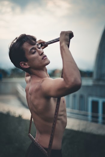 Topless Man Holding Frame