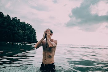 Topless Man in Beach