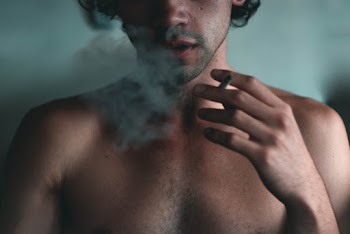 Topless Man Smoking 