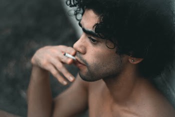 Topless Man Smoking
