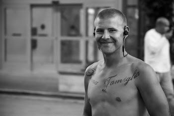 Topless Man Wearing Earphones