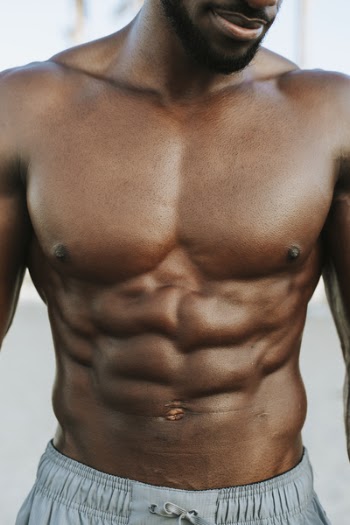 Topless Man Wearing Gray Drawstring Bottoms