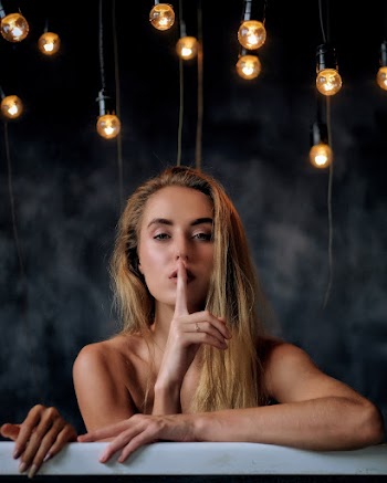 Topless Woman Doing Silence Sign
