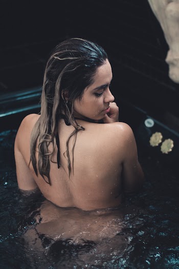 Topless Woman In A Hot Tub