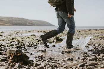 Tourist man walking at the beach | Free Photo - rawpixel