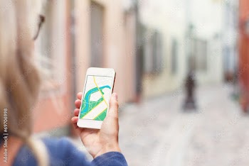 Tourist using navigation app on the mobile phone