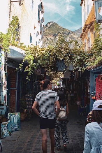 Tourists Looking At The Shops