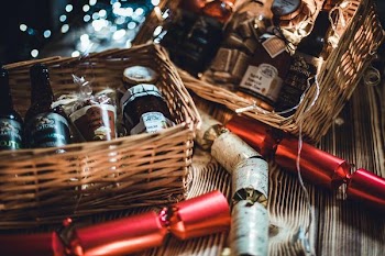 tow brown wicker baskets with bottles