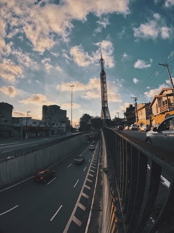 Tower in the Middle of a Busy City