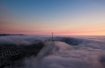 tower surrounded by clouds