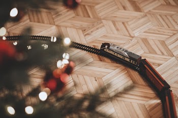 Toy train going around the Christmas tree 3