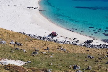 tractor at the shore during day