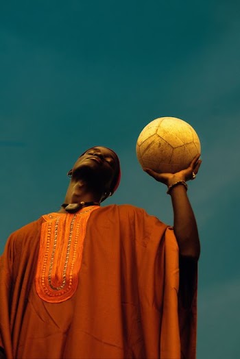 Traditional African Youth with Soccer Ball