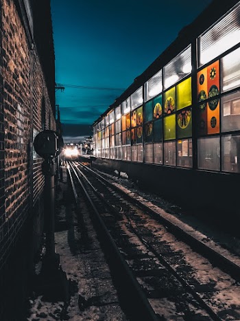 Train Near Glass Walled Building