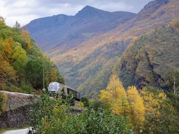 Train On Tracks Through Mountains