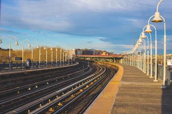 Train Railroad With White Light Posts Beside It