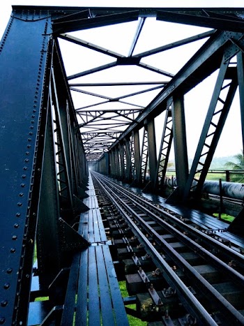 Train Track Bridge during Cloudy Skies