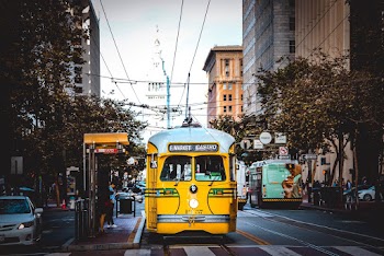Tram Stopping Before Pedestrian