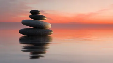 Tranquil Stacked Zen Stones at Sunrise Tranquil Stacked Zen Stones at Sunrise