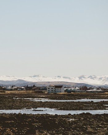 Trapped Water on the Ground With Buildings at Distance