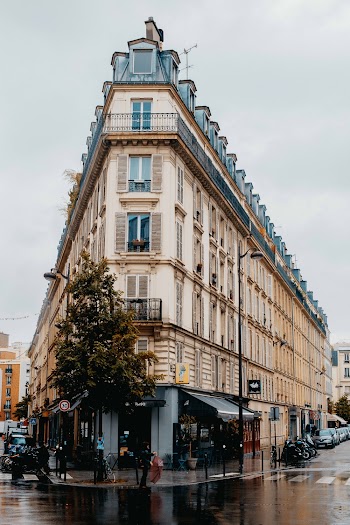 Triangular Brown Building Under Gray Sky