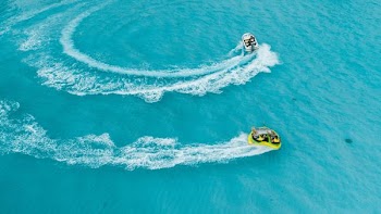 Tubing behind a boat in the Maldives