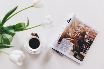 Tulips, cup of coffee and a magazine