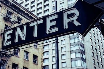 Turned Off Black and White Enter Signage