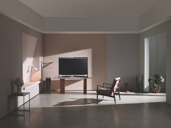 turned-off flat screen television near brown wall