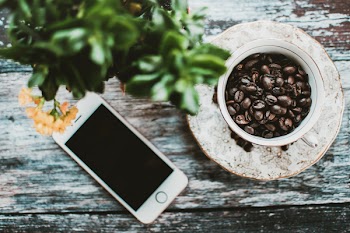 Turned-off Silver Iphone 5s Near Cup of Roaster Coffee Beans
