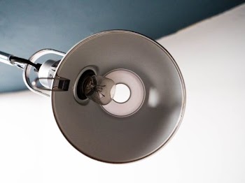 turned off white lamp with clear light bulb