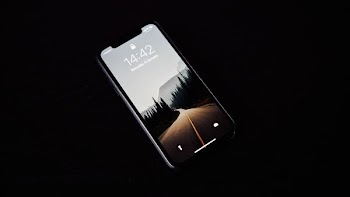 turned on black smartphone