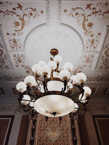 Turned-on Brown Framed Uplight Chandelier