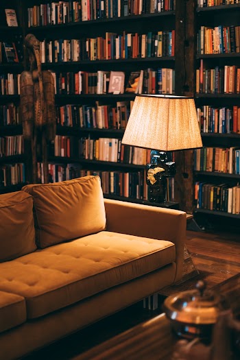 Turned on Floor Lamp Near Sofa