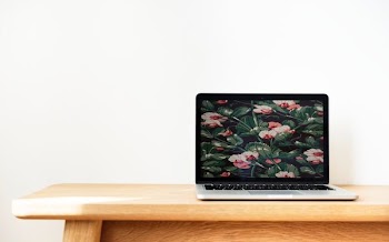 turned on grey and black laptop computer on table