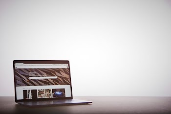 turned-on laptop computer on table
