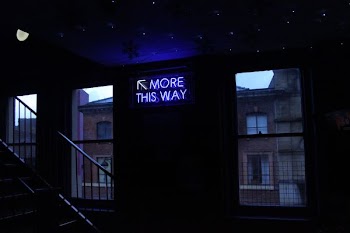 turned on more this way signage