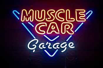turned on Muscle Car Garage neon light signage