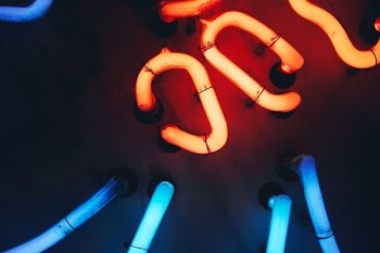 turned-on orange and blue CPU cooling system