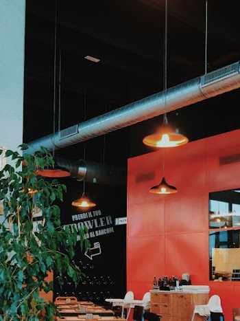 Turned-on Pendant Lamps Beside Dining Tables