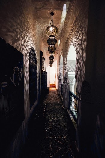 Turned on Pendant Lamps on Empty Pathway