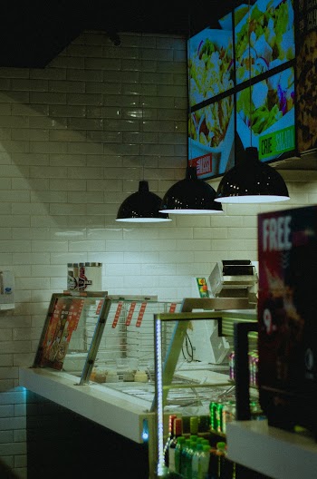 Turned-on Pendant Lamps over Food Display Case