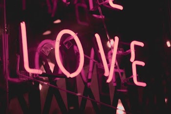 turned on pink Love neon signage