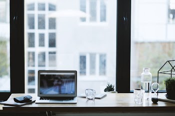 Turned on Silver Laptop on Tabletop