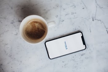 Turned-on Space Gray Iphone X Displaying Pexels Application