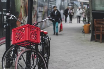 Two Black Bicycles on Post
